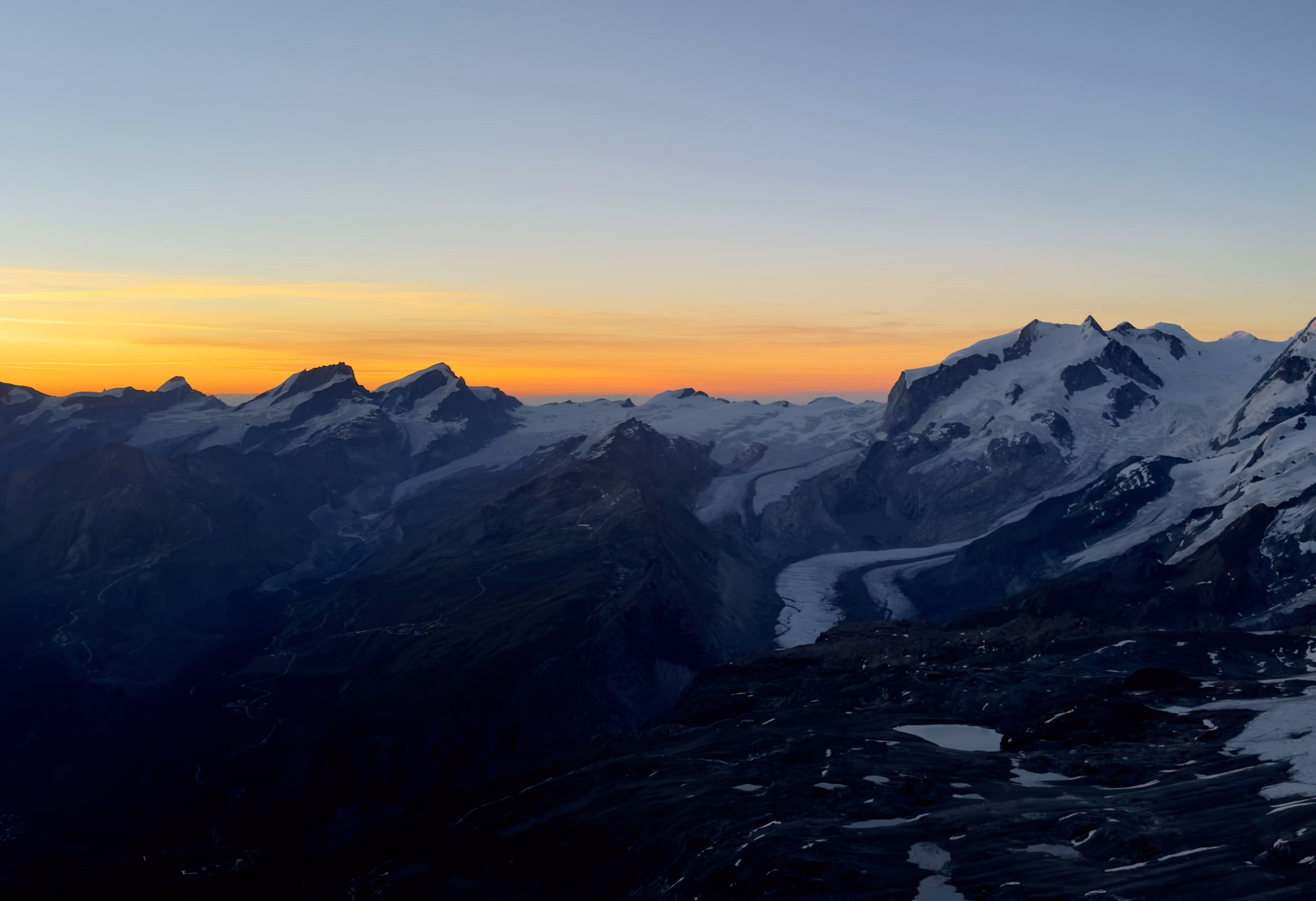 Sunrise over the Gorner Glacier from the Matterhorn, with Dufourspitze on the right.