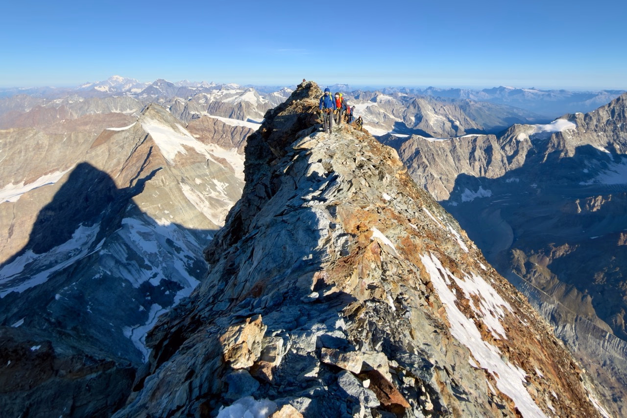 My favourite photo: taken from the Italian summit, looking towards the Swiss summit, with the Matterhorn’s immaculate shadow stretching across the mountains to the left.