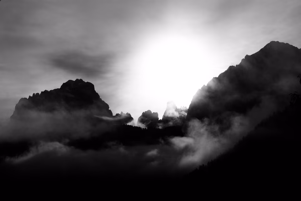 Dramatic storm light over Dolomite towers, digital photography, 2024