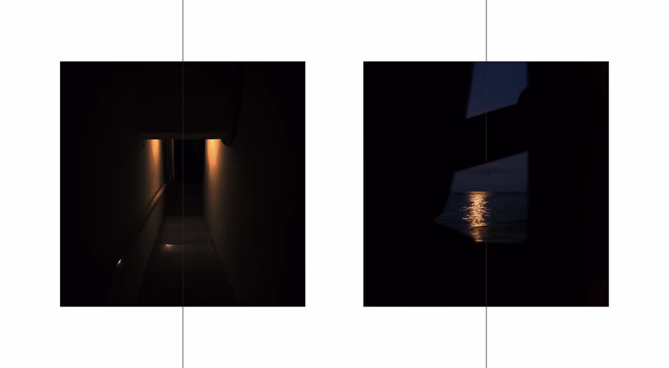 Off-centre wall light against dark exterior, night, symmetry and perception study