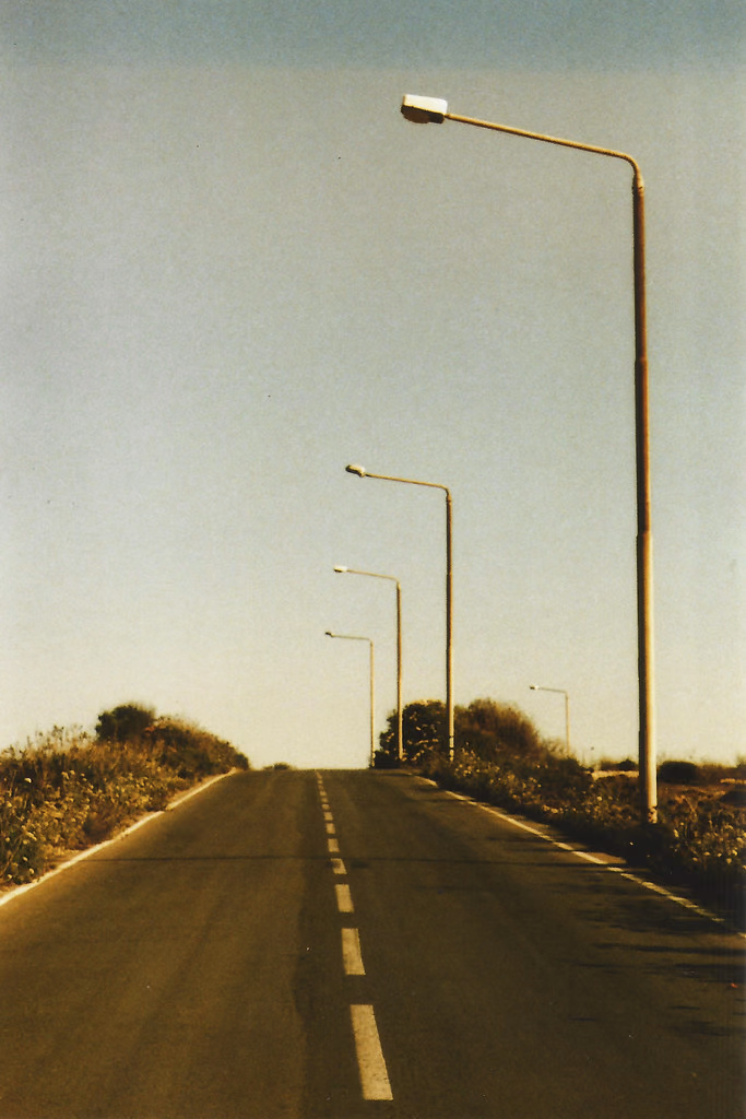 A long straight road and senset, summer time in Malta