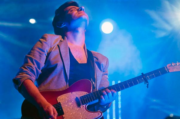 Guitarist looking up into stage lights, Airport Impressions live, Beland Festival, Malta